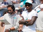 Miami Dolphins head coach Mike McDaniels with quarterback Tua Tagovailoa.