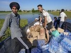 Volunteers on their way to assist in distribution of relief material in flood-affected areas, at Talwandi Rai Dadu village of Ajnala, in Amritsar district. (PTI FILE) Volunteers on their way to assist in distribution of relief material in flood-affected areas, at Talwandi Rai Dadu village of Ajnala, in Amritsar district. (PTI FILE)