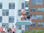 Pat McAfee jumped from a high dive in a Speedo.