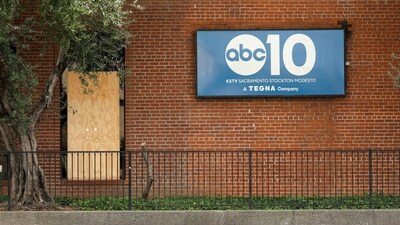 A window that was stuck by gunfire is covered with a board at ABC10 (KXTV) in Sacramento, California. (REUTERS)