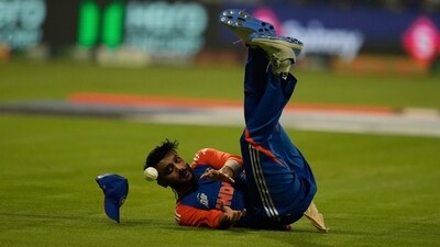 India's Axar Patel drops the catch of Oman's Hammad Mirza and hurt his head. (AP)