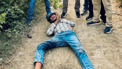 Security personnel with one of the five shooters allegedly involved in the firing at Bollywood actor Disha Patani's ancestral house, who was arrested along with an associate after an encounter, in Bareilly, UP. (PTI) Security personnel with one of the five shooters allegedly involved in the firing at Bollywood actor Disha Patani's ancestral house, who was arrested along with an associate after an encounter, in Bareilly, UP. (PTI)