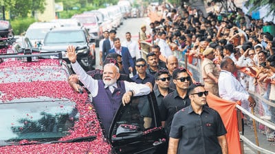 Prime Minister Narendra Modi waves to the gathering during a roadshow in Bhavnagar, Gujarat, on Saturday. (ANI) Prime Minister Narendra Modi waves to the gathering during a roadshow in Bhavnagar, Gujarat, on Saturday. (ANI)