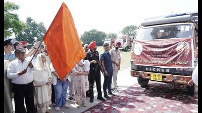 Punjab governor Gulab Chand Kataria flagging off truckloads of relief material for flood-affected families from Baba Mohan Dass Ashram in Jalandhar on Saturday. (Sourced)