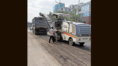 Repair work underway on Airport Road in Mohali. (HT Photo)