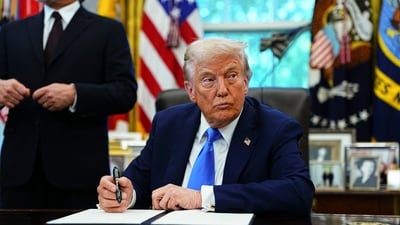 US President Donald Trump signs an executive order authorizing the Trump Gold Card in the Oval Office of the White House in Washington, DC, US, on Friday, Sept. 19, 2025. (Bloomberg) US President Donald Trump signs an executive order authorizing the Trump Gold Card in the Oval Office of the White House in Washington, DC, US, on Friday, Sept. 19, 2025. (Bloomberg)