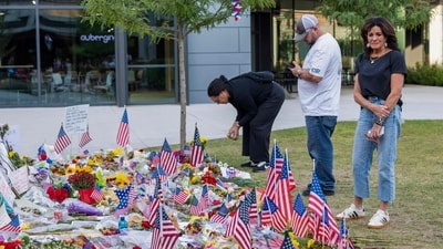 People gather to pay respects at a memorial where right-wing political activist Charlie Kirk was shot at the main campus of Utah Valley University in Orem, Utah, on September 19, 2025. Kirk, a close ally of President Donald Trump, was shot dead last week during a speaking event on a Utah university campus. (Photo by Melissa Majchrzak / AFP) (AFP) People gather to pay respects at a memorial where right-wing political activist Charlie Kirk was shot at the main campus of Utah Valley University in Orem, Utah, on September 19, 2025. Kirk, a close ally of President Donald Trump, was shot dead last week during a speaking event on a Utah university campus. (Photo by Melissa Majchrzak / AFP) (AFP)
