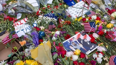 Flowers and signs left by people that gathered to pay respects to right-wing political activist Charlie Kirk are seen at a memorial set up where he was shot at the main campus of Utah Valley University in Orem, Utah, on September 19, 2025. (AFP) Flowers and signs left by people that gathered to pay respects to right-wing political activist Charlie Kirk are seen at a memorial set up where he was shot at the main campus of Utah Valley University in Orem, Utah, on September 19, 2025. (AFP)
