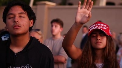 People gather at a makeshift memorial during a vigil for right-wing activist and Turning Point USA founder Charlie Kirk outside their headquarters in Phoenix, Arizona on September 19, 2025. Kirk, a close ally of President Donald Trump, was shot dead last week during a speaking event on a Utah university campus. (Photo by CHARLY TRIBALLEAU / AFP) (AFP) People gather at a makeshift memorial during a vigil for right-wing activist and Turning Point USA founder Charlie Kirk outside their headquarters in Phoenix, Arizona on September 19, 2025. Kirk, a close ally of President Donald Trump, was shot dead last week during a speaking event on a Utah university campus. (Photo by CHARLY TRIBALLEAU / AFP) (AFP)