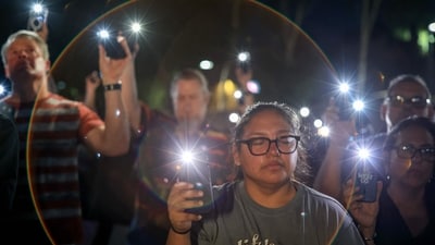 People hold up their phone flashlights and pray during a vigil for Charlie Kirk outside the headquarters of Turning Point USA on September 19, 2025, in Phoenix, Arizona. (Getty Images via AFP) People hold up their phone flashlights and pray during a vigil for Charlie Kirk outside the headquarters of Turning Point USA on September 19, 2025, in Phoenix, Arizona. (Getty Images via AFP)