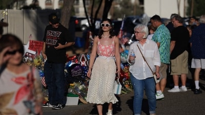 People visit a memorial for Charlie Kirk outside of the headquarters of Turning Point USA on September 19, 2025 in Phoenix, Arizona. (Getty Images via AFP) People visit a memorial for Charlie Kirk outside of the headquarters of Turning Point USA on September 19, 2025 in Phoenix, Arizona. (Getty Images via AFP)