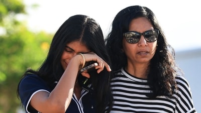 Adiella Philip (L) and Elizabeth Mazhuvencherry visit the makeshift memorial for Charlie Kirk outside of the headquarters of Turning Point USA on September 19, 2025 in Phoenix, Arizona. (Getty Images via AFP) Adiella Philip (L) and Elizabeth Mazhuvencherry visit the makeshift memorial for Charlie Kirk outside of the headquarters of Turning Point USA on September 19, 2025 in Phoenix, Arizona. (Getty Images via AFP)
