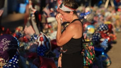 Kristen Abbinante wipes away tears as she visits the makeshift memorial for Charlie Kirk outside the headquarters of Turning Point USA on September 19, 2025, in Phoenix, Arizona. (Getty Images via AFP) Kristen Abbinante wipes away tears as she visits the makeshift memorial for Charlie Kirk outside the headquarters of Turning Point USA on September 19, 2025, in Phoenix, Arizona. (Getty Images via AFP)