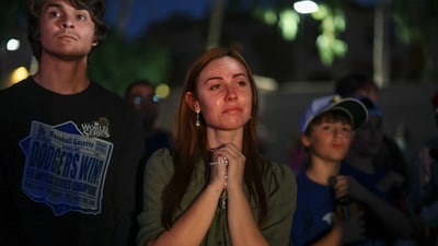Emily Di Julio attends a vigil for Charlie Kirk outside the headquarters of Turning Point USA on September 19, 2025, in Phoenix, Arizona. (Getty Images via AFP) Emily Di Julio attends a vigil for Charlie Kirk outside the headquarters of Turning Point USA on September 19, 2025, in Phoenix, Arizona. (Getty Images via AFP)