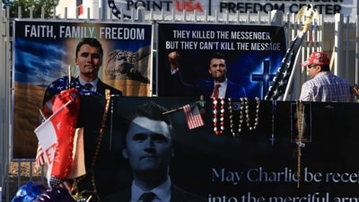 Shaa Mahbi places a poster up in the makeshift memorial for Charlie Kirk outside the headquarters of Turning Point USA on September 19, 2025, in Phoenix, Arizona. (Getty Images via AFP) Shaa Mahbi places a poster up in the makeshift memorial for Charlie Kirk outside the headquarters of Turning Point USA on September 19, 2025, in Phoenix, Arizona. (Getty Images via AFP)