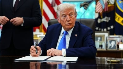 US President Donald Trump signs an executive order authorising the Trump Gold Card in the Oval Office of the White House in Washington (Bloomberg) US President Donald Trump signs an executive order authorising the Trump Gold Card in the Oval Office of the White House in Washington (Bloomberg)