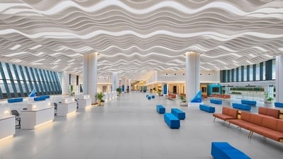 India's largest cruise terminal features wave-like pattern on not just the ceiling but also has blue-coloured benches. The interiors are minimalist yet functional. India's largest cruise terminal features wave-like pattern on not just the ceiling but also has blue-coloured benches. The interiors are minimalist yet functional.