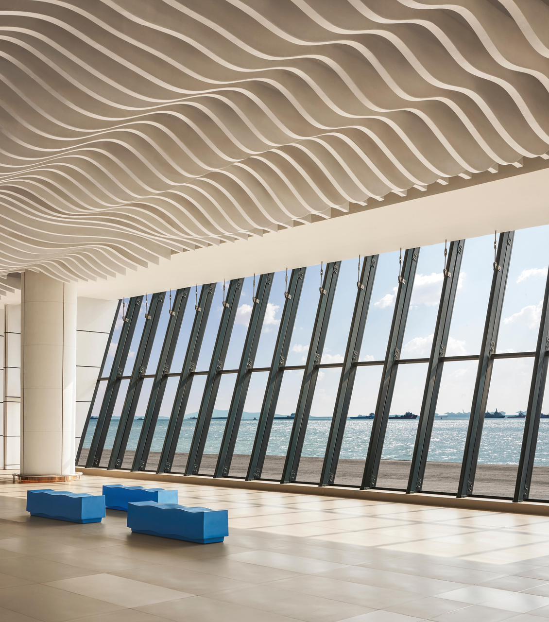 Mumbai International Cruise Terminal is equipped with blue benches, also imitating a wavy design. Mumbai International Cruise Terminal is equipped with blue benches, also imitating a wavy design.