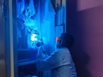 An official of the fingerprint bureau at work. (HT) An official of the fingerprint bureau at work. (HT)