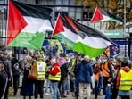 Pro-Gaza protesters holds Palestinian flags as they protest against Israel's offensive on the Gaza strip in Rotterdam on September 21, 2025. Pro-Gaza protesters holds Palestinian flags as they protest against Israel's offensive on the Gaza strip in Rotterdam on September 21, 2025.