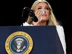 Erika Kirk wipes tears as she speaks at a memorial for her husband, conservative activist Charlie Kirk.