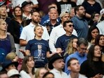 A woman listens during a worship song before the start of a memorial for conservative activist Charlie Kirk