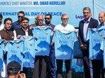J&K CM Omar Abdullah unveils the new Jersey of Real Kashmir Football Club on the occasion of International Peace Day, at TRC Football Stadium, in Srinagar, on Sunday. (PTI) J&K CM Omar Abdullah unveils the new Jersey of Real Kashmir Football Club on the occasion of International Peace Day, at TRC Football Stadium, in Srinagar, on Sunday. (PTI)