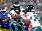 Jalen Hurts #1 hands off the ball to Saquon Barkley #26 of the Philadelphia Eagles during the second quarter against the Los Angeles Rams Jalen Hurts #1 hands off the ball to Saquon Barkley #26 of the Philadelphia Eagles during the second quarter against the Los Angeles Rams