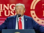 US President Donald Trump speaks onstage during a memorial service for slain conservative commentator Charlie Kirk at State Farm Stadium.
