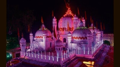 An illuminated Mata Mansa Devi temple on the eve of Navratri festival on Sunday. (Sant Arora/HT)