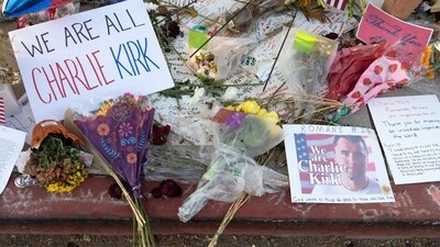 Flowers and signs at a memorial outside of Turning Point USA headquarters in Phoenix, Arizona, US, on Saturday, Sept. 20, 2025. (Bloomberg) Flowers and signs at a memorial outside of Turning Point USA headquarters in Phoenix, Arizona, US, on Saturday, Sept. 20, 2025. (Bloomberg)