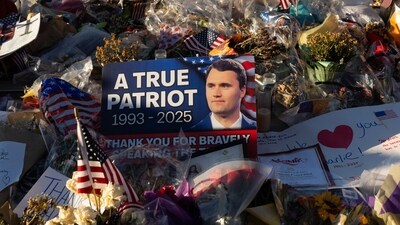 An image of Turning Point USA founder Charlie Kirk among flowers and signs at a memorial outside of Turning Point USA headquarters in Phoenix, Arizona, US, on Saturday, Sept. 20, 2025. (Bloomberg) An image of Turning Point USA founder Charlie Kirk among flowers and signs at a memorial outside of Turning Point USA headquarters in Phoenix, Arizona, US, on Saturday, Sept. 20, 2025. (Bloomberg)