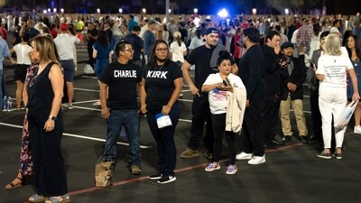 Attendees wait in line to enter a memorial service for Turning Point USA founder Charlie Kirk at State Farm Stadium in Glendale, Arizona, US, on Sunday, Sept. 21, 2025. President Donald Trump is set to eulogize Charlie Kirk as a patriot and Christian martyr on Sunday as the political activist's assassination continues to galvanize conservative support for the president. Photographer: Rebecca Noble/Bloomberg (Bloomberg) Attendees wait in line to enter a memorial service for Turning Point USA founder Charlie Kirk at State Farm Stadium in Glendale, Arizona, US, on Sunday, Sept. 21, 2025. President Donald Trump is set to eulogize Charlie Kirk as a patriot and Christian martyr on Sunday as the political activist's assassination continues to galvanize conservative support for the president. Photographer: Rebecca Noble/Bloomberg (Bloomberg)