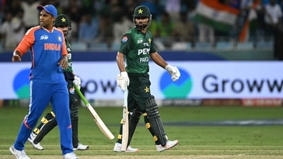 Pakistan's Fakhar Zaman (C) walks back to the pavilion after his dismissal as India's captain Suryakumar Yadav (L) gestures during their Asia Cup 2025 match. (AFP) Pakistan's Fakhar Zaman (C) walks back to the pavilion after his dismissal as India's captain Suryakumar Yadav (L) gestures during their Asia Cup 2025 match. (AFP)