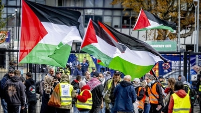 Pro-Gaza protesters holds Palestinian flags as they protest against Israel's offensive on the Gaza strip in Rotterdam on September 21, 2025. (AFP) Pro-Gaza protesters holds Palestinian flags as they protest against Israel's offensive on the Gaza strip in Rotterdam on September 21, 2025. (AFP)