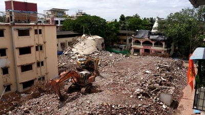 One month after the Bombay High Court ordered the demolition of two dangerously dilapidated buildings in Vasai (West), the Vasai Virar Municipal Corporation (VVMC) has started razing Pushpanjali and Deepanjali CHS to pave the way for redevelopment. The photo shows bulldozers tearing down the structures. (Deepak Turbhekar ) One month after the Bombay High Court ordered the demolition of two dangerously dilapidated buildings in Vasai (West), the Vasai Virar Municipal Corporation (VVMC) has started razing Pushpanjali and Deepanjali CHS to pave the way for redevelopment. The photo shows bulldozers tearing down the structures. (Deepak Turbhekar )