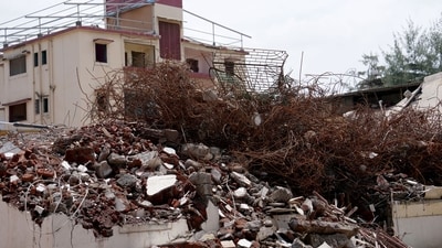 On February 28, 2025, the VVMC classified building numbers H-1 and H-2 of Deepanjali Cooperative Housing Society (CHS) and building numbers H-3 and H-4 of Pushpanjali CHS at Diwan and Sons Housing Enclave on Ambadi Road in Vasai (West) as C-1 structures declared too dangerous for habitation and requiring immediate demolition. The photo shows debris from both the buildings of Pushpanjali CHS and one building of Deepanjali CHS. The building shown in the photo is the second structure of Deepanjali CHS scheduled for demolition in the coming days. (Deepak Turbhekar ) On February 28, 2025, the VVMC classified building numbers H-1 and H-2 of Deepanjali Cooperative Housing Society (CHS) and building numbers H-3 and H-4 of Pushpanjali CHS at Diwan and Sons Housing Enclave on Ambadi Road in Vasai (West) as C-1 structures declared too dangerous for habitation and requiring immediate demolition. The photo shows debris from both the buildings of Pushpanjali CHS and one building of Deepanjali CHS. The building shown in the photo is the second structure of Deepanjali CHS scheduled for demolition in the coming days. (Deepak Turbhekar )