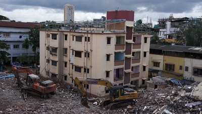 The opposing members, who earlier lived in the buildings now being demolished by bulldozers, had approached the Bombay High Court. Last month, the court ruled that a minority cannot stall redevelopment once buildings are declared unsafe and the majority has approved it. It observed that while members may pursue objections legally, this cannot be done at the cost of lives or by delaying demolition. The court directed residents to vacate and authorised the VVMC to evict them with police assistance if necessary. (Deepak Turbhekar ) The opposing members, who earlier lived in the buildings now being demolished by bulldozers, had approached the Bombay High Court. Last month, the court ruled that a minority cannot stall redevelopment once buildings are declared unsafe and the majority has approved it. It observed that while members may pursue objections legally, this cannot be done at the cost of lives or by delaying demolition. The court directed residents to vacate and authorised the VVMC to evict them with police assistance if necessary. (Deepak Turbhekar )