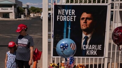 Nicole and Amalia, who asked to be identified by their first names only, stand for a photo at a makeshift memorial for Charlie Kirk outside Turning Point USA headquarters in Phoenix Saturday, Sept. 20, 2025. (AP Photo/Jae C. Hong) (AP) Nicole and Amalia, who asked to be identified by their first names only, stand for a photo at a makeshift memorial for Charlie Kirk outside Turning Point USA headquarters in Phoenix Saturday, Sept. 20, 2025. (AP Photo/Jae C. Hong) (AP)