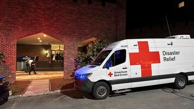 An American Red Cross Disaster Relief van is parked outside a hotel that is acting as a reunification center after a shooting at a country club in Nashua, New Hampshire, Saturday, Sept. 20, 2025. (AP) An American Red Cross Disaster Relief van is parked outside a hotel that is acting as a reunification center after a shooting at a country club in Nashua, New Hampshire, Saturday, Sept. 20, 2025. (AP)