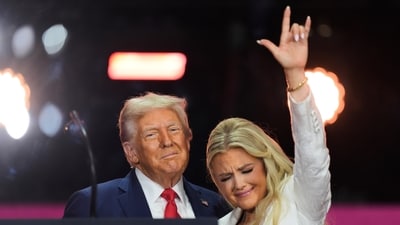 President Donald Trump, left, stands with Erika Kurk at the conclusion of a memorial for her husband (AP) President Donald Trump, left, stands with Erika Kurk at the conclusion of a memorial for her husband (AP)