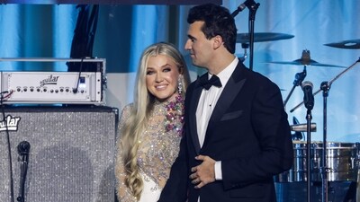 Charlie Kirk (R) and and his wife Erika Lane Frantzve (L) on stage during the Turning Point USA Inaugural-Eve Ball (Getty Images via AFP)