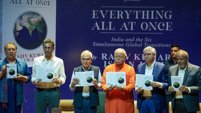 Rashtriya Swayamsevak Sangh (RSS) chief Mohan Bhagwat and others launch the book 'Everything All At Once: India and the Six Simultaneous Global Transitions' written by Rajiv Kumar and Ishan Joshi at a ceremony in New Delhi on Sunday, September 21, 2025 (PTI) Rashtriya Swayamsevak Sangh (RSS) chief Mohan Bhagwat and others launch the book 'Everything All At Once: India and the Six Simultaneous Global Transitions' written by Rajiv Kumar and Ishan Joshi at a ceremony in New Delhi on Sunday, September 21, 2025 (PTI)