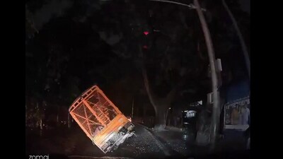 A video shows a truck toppling over on a pothole-filled road in central Bengaluru, highlighting the city's deteriorating infrastructure. A video shows a truck toppling over on a pothole-filled road in central Bengaluru, highlighting the city's deteriorating infrastructure.