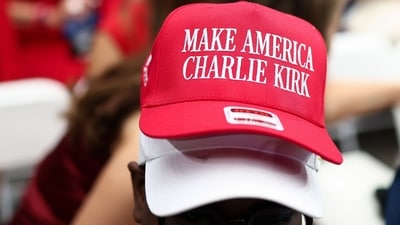 A man wears several hats, including one reading "Make America Charlie Kirk" ahead of a public memorial service for right-wing activist Charlie Kirk at State Farm Stadium in Glendale, Arizona, on September 21, 2025. (Photo by CHARLY TRIBALLEAU / AFP) (AFP) A man wears several hats, including one reading "Make America Charlie Kirk" ahead of a public memorial service for right-wing activist Charlie Kirk at State Farm Stadium in Glendale, Arizona, on September 21, 2025. (Photo by CHARLY TRIBALLEAU / AFP) (AFP)