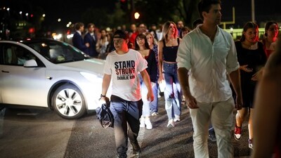 People arrive to attend a memorial service for slain conservative commentator Charlie Kirk at State Farm Stadium, in Glendale, Arizona, U.S., September 21, 2025.  REUTERS/Carlos Barria (REUTERS)