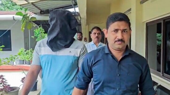 Driver of ex-IAS trainee officer Puja Khedkar's family, Pradeep Salunkhe under arrest in connection with alleged kidnapping of a truck cleaner following a road rage incident, in Navi Mumbai. (ANI Video Grab)