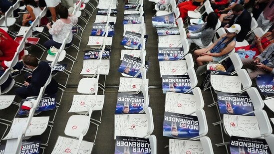 Posters of conservative activist Charlie Kirk are seen on chairs before his memorial Sunday, Sept. 21, 2025, at State Farm Stadium in Glendale, Ariz. (AP Photo/Ross D. Franklin)(AP)
