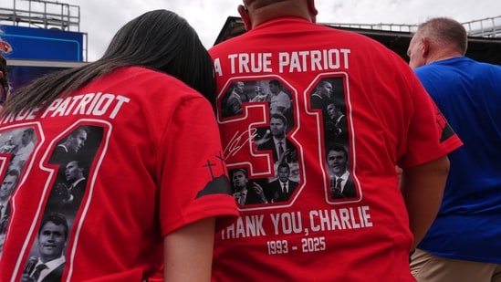 People wear shirts for Charlie Kirk outside before a memorial for the conservative activist Sunday, Sept. 21, 2025, at State Farm Stadium in Glendale, Ariz. (AP Photo/Jae C. Hong)(AP)
