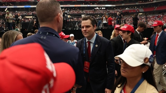 Former US Rep. Matt Gaetz (C) arrives to attend the public memorial service for right-wing activist Charlie Kirk at State Farm Stadium in Glendale, Arizona, on September 21, 2025. (Photo by Patrick T. Fallon / AFP)(AFP)